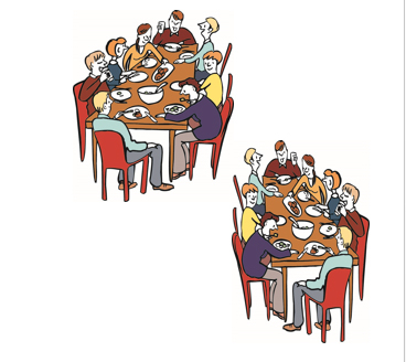 viele Menschen sitzen an Tischen und essen