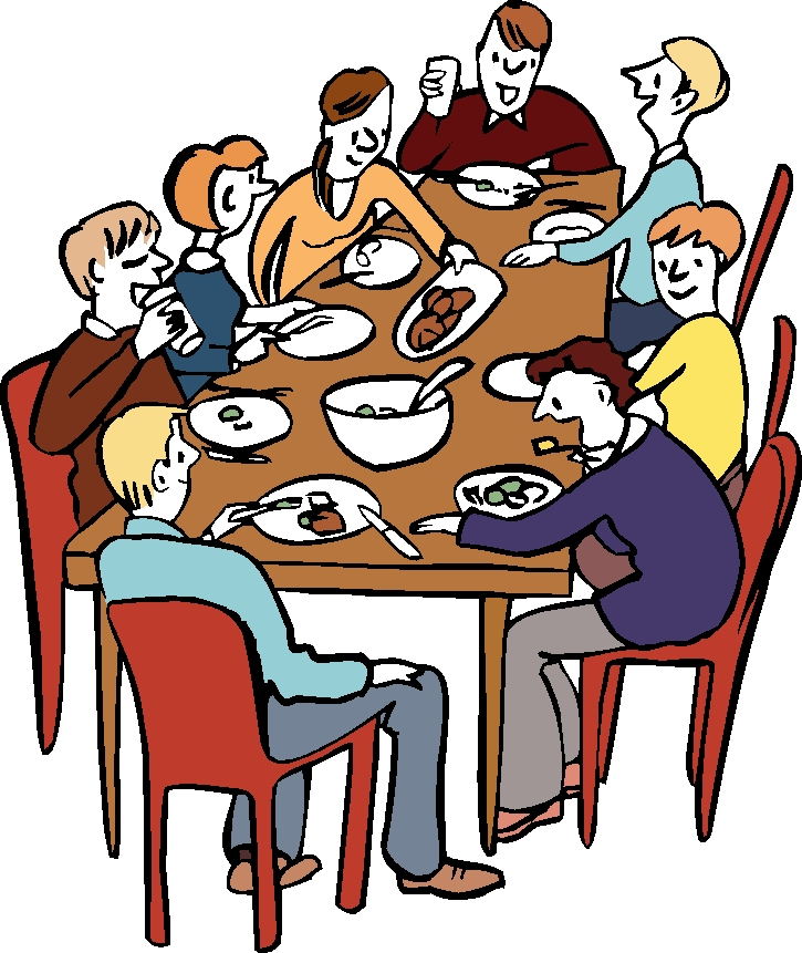 Viele Menschen sitzen am Tisch und essen